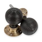 EBONISED BEEHIVE DOOR KNOBS WITH ANTIQUE BRASS BACKPLATES
