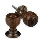 ROSEWOOD GEORGIAN DOOR KNOBS WITH ANTIQUE BRASS BACKPLATES